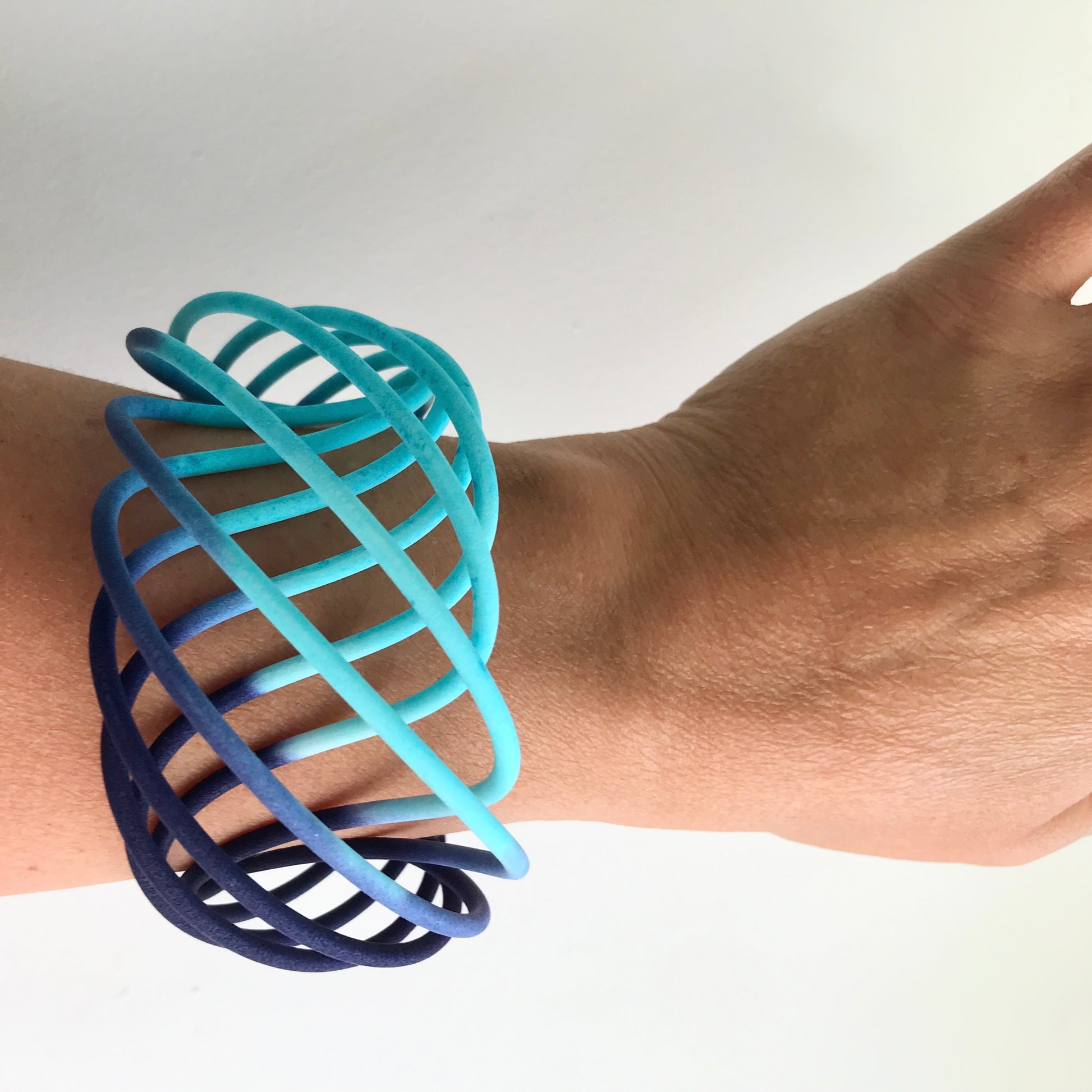 Turquoise Blue fade wide vortex bangle on model