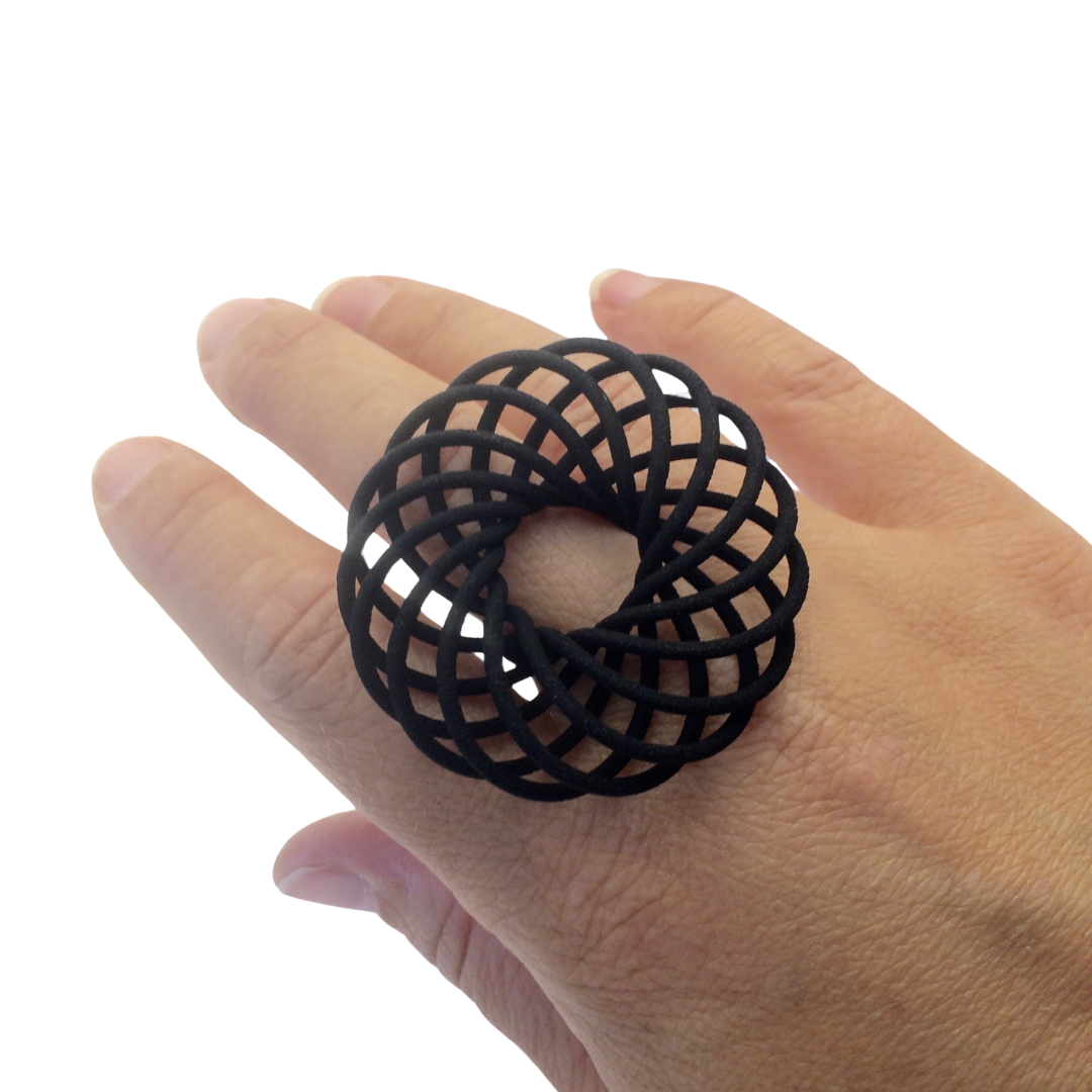 Black Vortex statement ring being worn on a hand