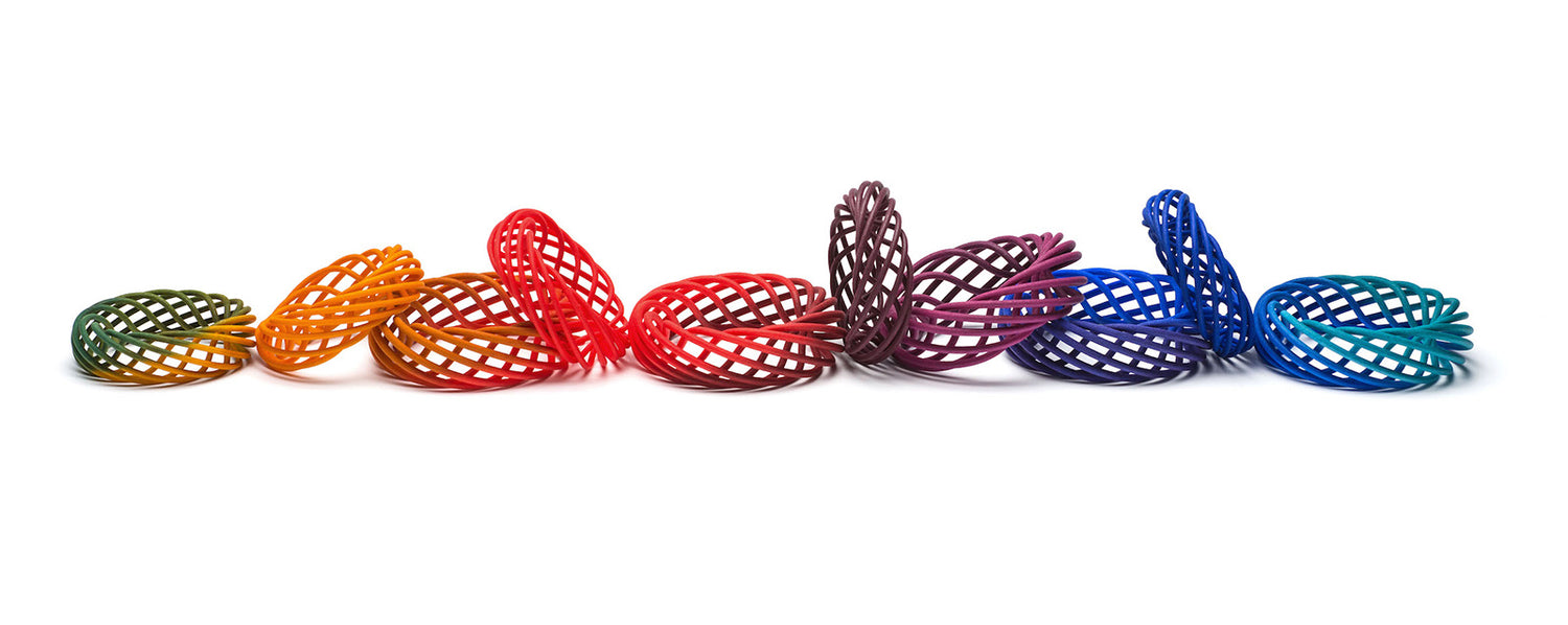 Rainbow colours of Vortex nylon 3D printed bangle by Katy Luxton