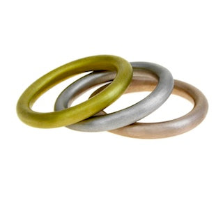 set of three halo rings in different coloured golds.