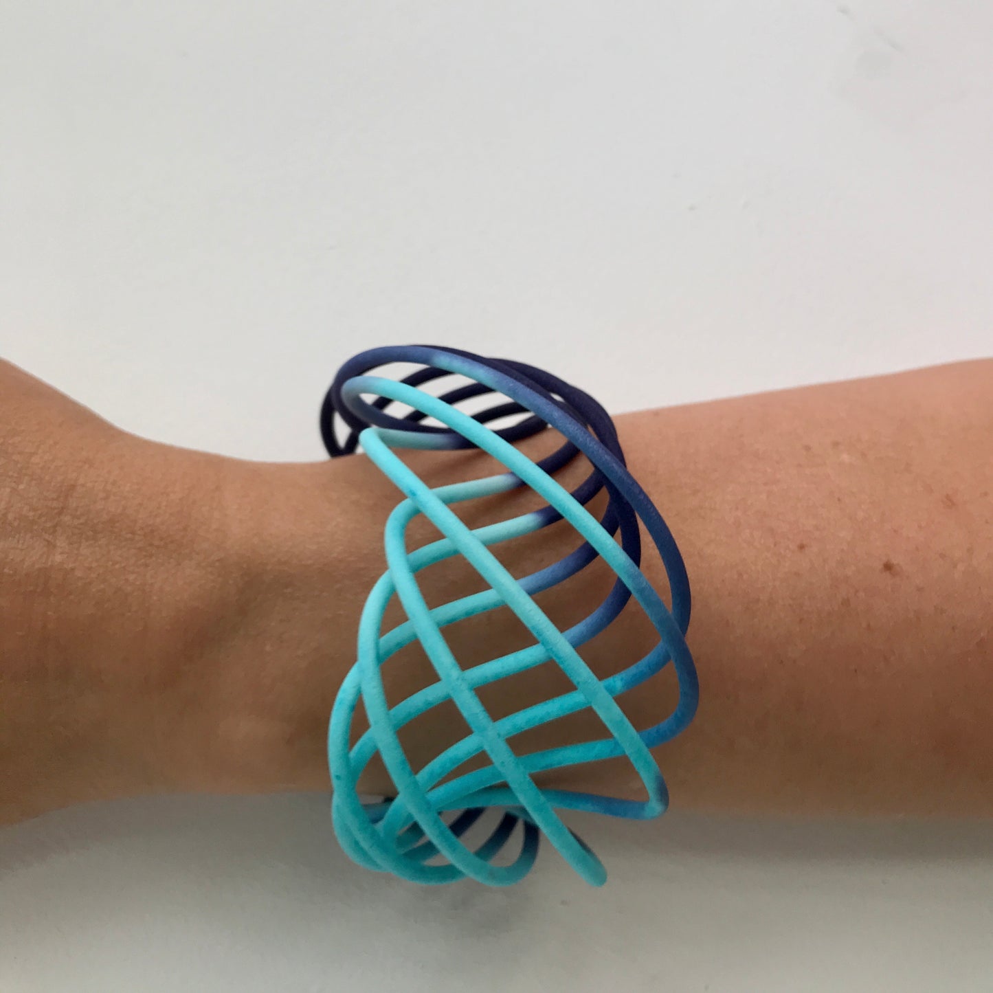 Turquoise Blue fade wide vortex bangle on model