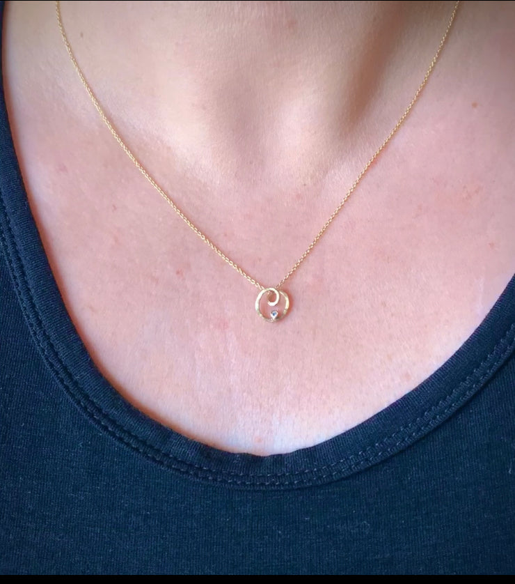 Image shows Katy wearing the pendant for scale.