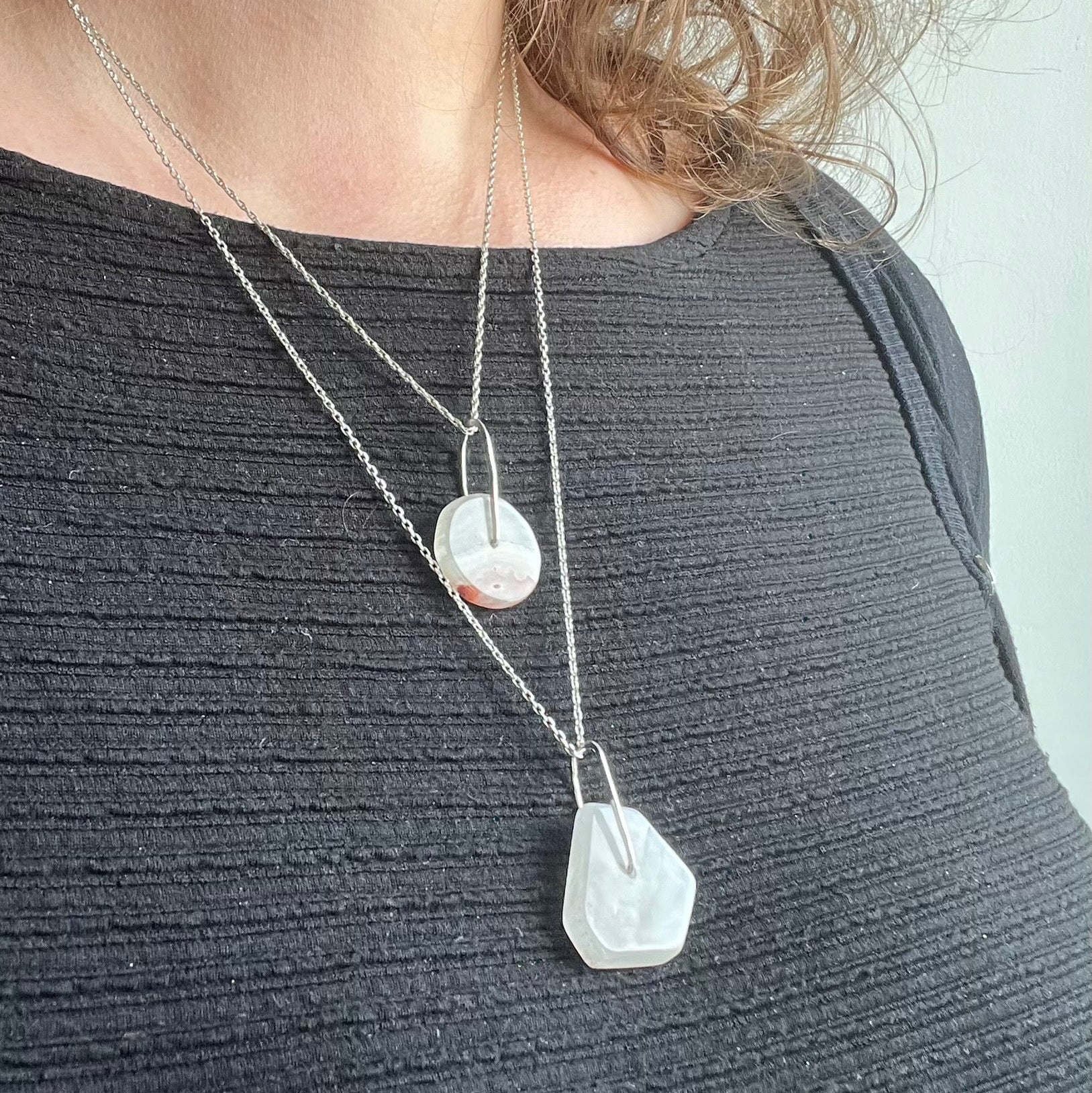 two pendants on a model
