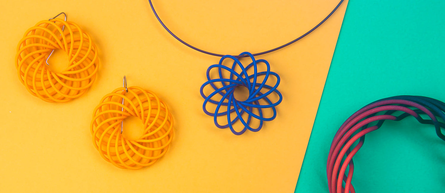 Vortex and orbit range of colourful 3D printed nylon jewellery by Katy Luxton