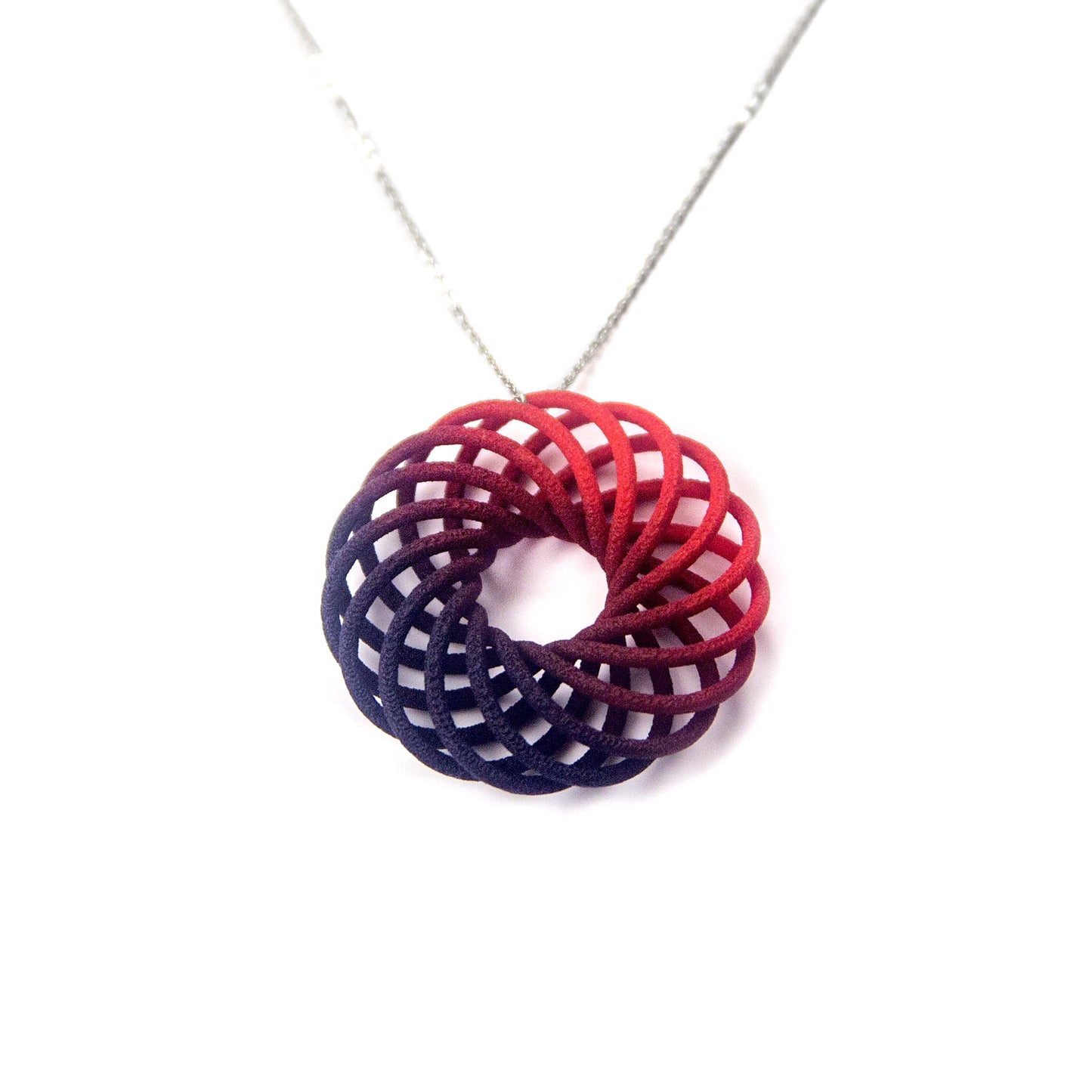 Small scarlet purple fade Vortex 3D printed pendant on a silver chain by Katy Luxton Jewellery